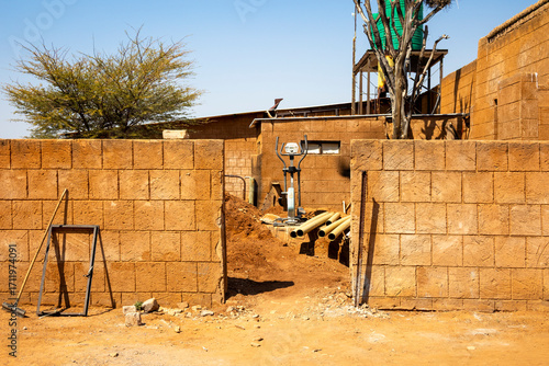 Outjo, Namibia: a house under construction against the local landscape.