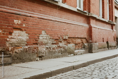Wallpaper Mural Old brick wall with visible damage on the street side Torontodigital.ca