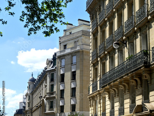 Paris, June 2025 : Visit of the magnificent city of Paris, Capital of France - View on different facades of buildings built by Baron Haussmann