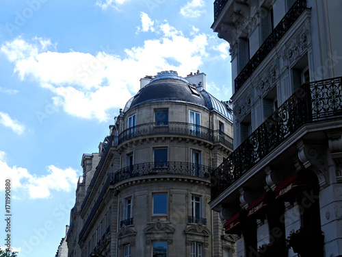 Paris, June 2025 : Visit of the magnificent city of Paris, Capital of France - View on different facades of buildings built by Baron Haussmann