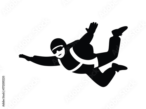 Silhouette of a skydiver in freefall with arms and legs extended