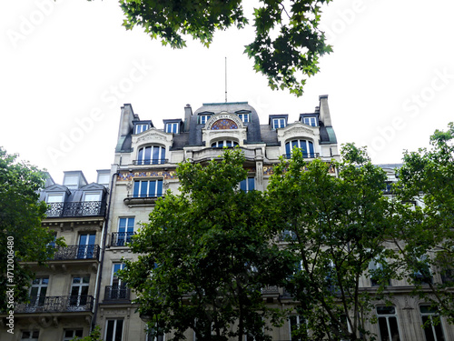 Paris, June 2025 : Visit of the magnificent city of Paris, Capital of France - View on different facades of buildings built by Baron Haussmann