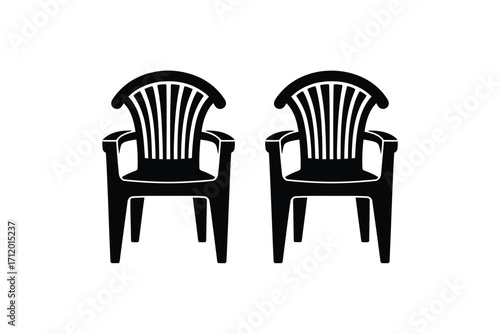 Two black plastic outdoor chairs side by side