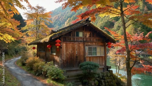 Rustic wooden cabin nestled amidst vibrant autumn foliage with red lanterns hanging outside offers a serene escape into nature's beauty and tranquility in a picturesque landscape