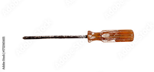 Photography A well used, rusty Phillips head screwdriver with an amber handle