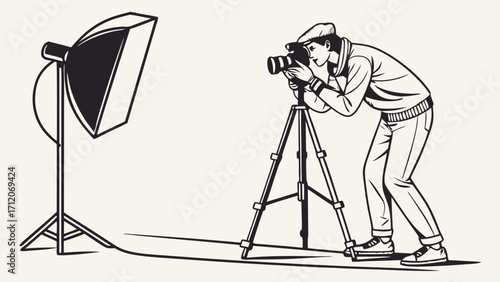Photographer using camera on tripod with studio lighting.