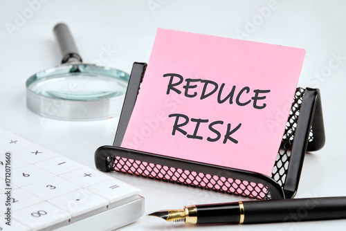 Conceptual reduce risk symbol. Copy space. Words REDUCE RISK on the sticker for memory