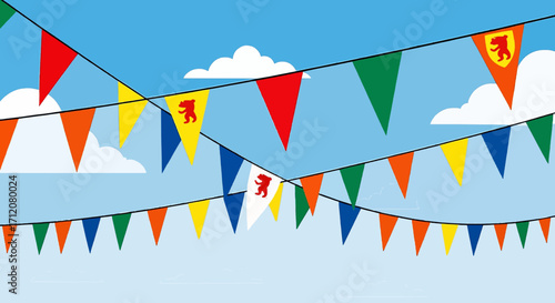 Colorful bunting flags with bear symbol against blue sky