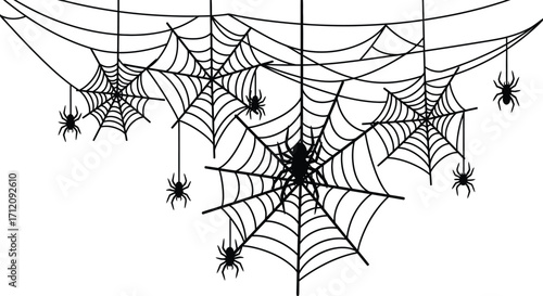 Spooky spiderwebs and hanging spiders create a creepy Halloween decoration