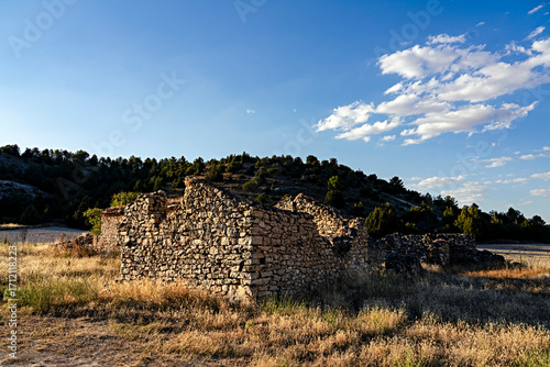 Rural architecture in Spain, abandoned and semi-ruined due to migration to cities, with daylight illumination.