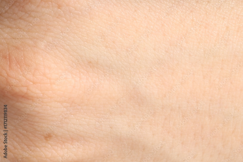 Fototapeta premium Human skin, closeup view. Detailed texture of surface