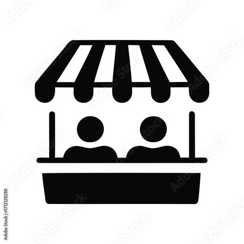 people at a market stall with striped awning. silhouette of a man sitting in a chair