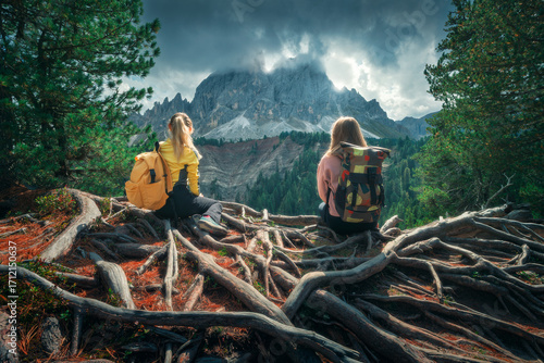 Two young women with backpa...