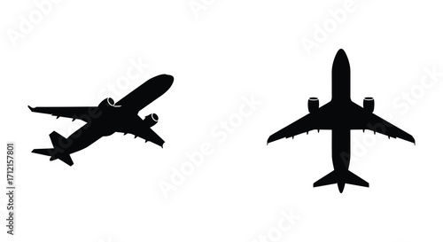 Two black silhouettes of passenger airplanes viewed from directly above