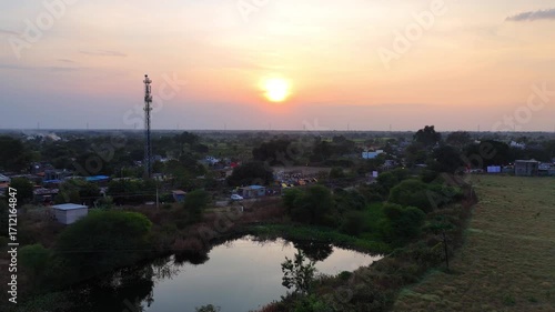 Beautiful 4K Aerial Drone Footage of Golden Sunset and Peaceful Sunrise over Indian Countryside with Farmlands, Trees, and Villages