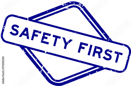 Grunge blue safety first word rubber seal stamp on white background