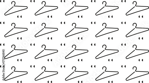 Collection of nine different black and white clothing hangers in a grid pattern