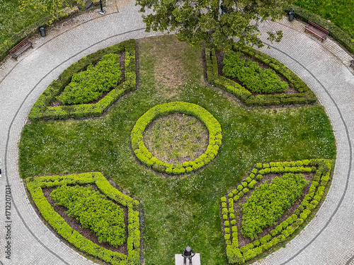 The square in front of the Niechorze Lighthouse on the Baltic Sea in Poland, seen from above. A statue of the lighthouse keeper is visible