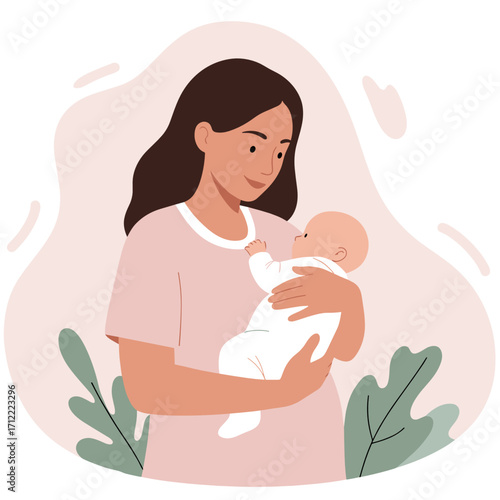 Young woman holding her baby in arms with a gentle smile indoors  