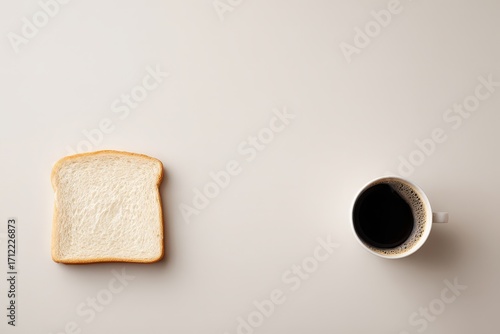 Slice of white bread and black coffee on plain background