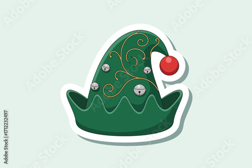 Green elf hat with red pom pom and festive decorations