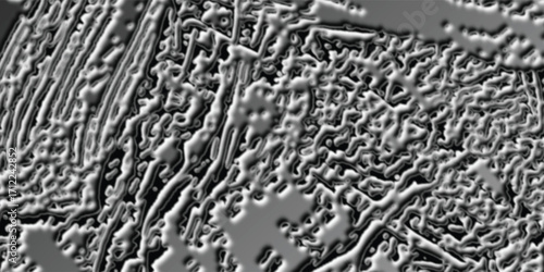 Microscopic Metallic Surface with Intricate Lamellar and Granular Textures.