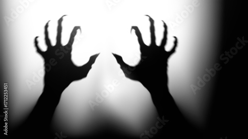 Shadow overlay effect for halloween background with Terrifying scary hands with long nails,Creepy monster claw,silhouette of hands,zombie hand rising out of a graveyard