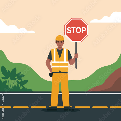 Construction worker holding a stop sign on a road with mountains behind him