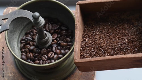 Grinding coffee beans in an old-fashioned grinder for a fresh morning brew