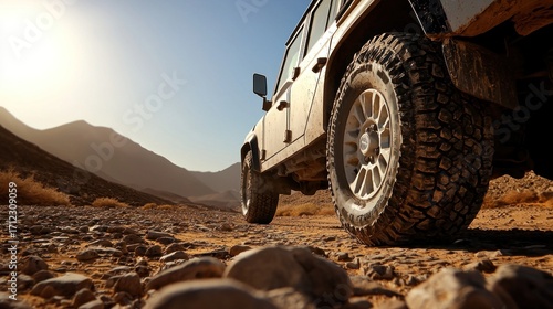 Off-road vehicle on a rocky desert path