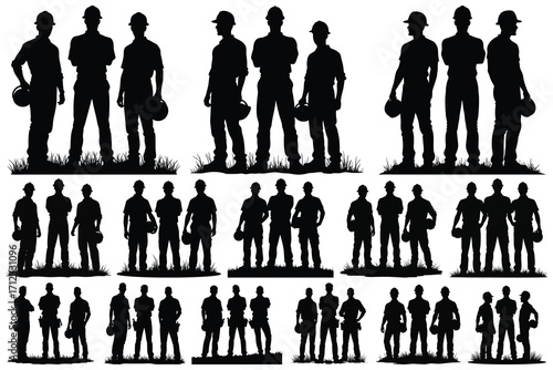Black silhouettes of construction workers with hard hats and grass