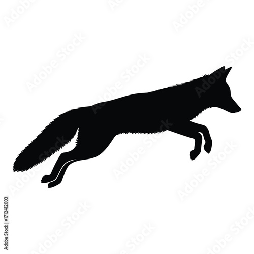 Silhouette of a fox mid-leap capturing dynamic animal movement and agility silhouette