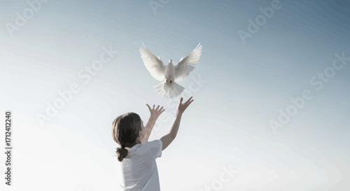 A Child Releasing A White Dove In A Symbol Of Freedom And Pureness Against The Sky