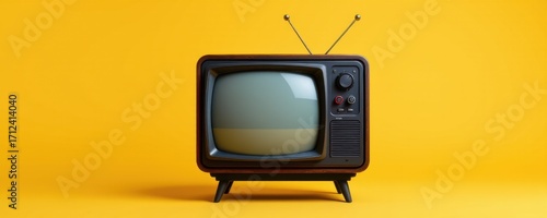 Vintage television set with antennas and screen on bright yellow background, retro electronic device, old fashioned TV for entertainment or nostaia themes