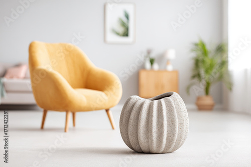 modern interior scene with uniquely textured vase set against clean ultrabright background