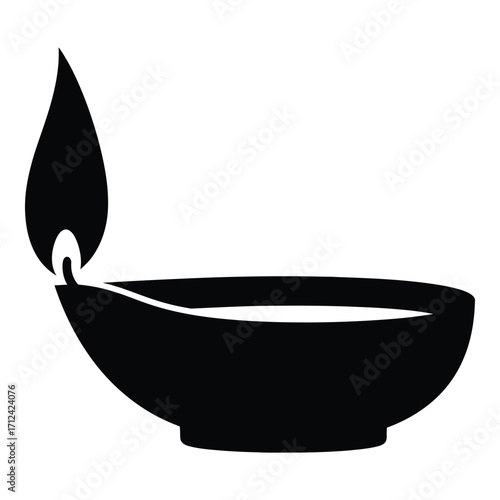 Simple silhouette of a lit diya oil lamp for festive and spiritual occasions silhouette