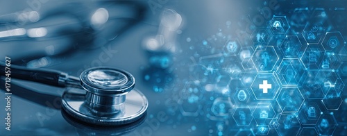 Medical stethoscope on a blue surface with digital health technology.