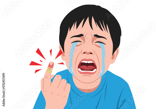 A young boy cries after hurting his finger.