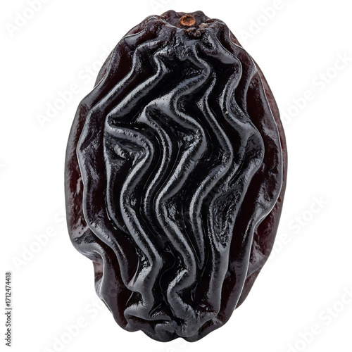 Close-up of a single dried raisin on black background