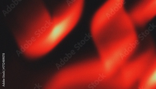 Abstract fiery red and orange light streaks with grainy texture against a dark background