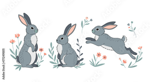 Three cute gray rabbits playing among spring flowers and greenery.