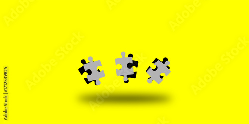 3 pieces of puzzel isolated on yellow background