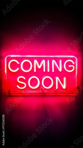 Vertical COMING SOON neon sign glowing in red and pink on dark background