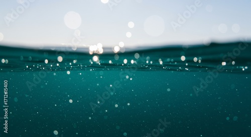 Wallpaper Mural An underwater photo showing the surface and glowing bubbles. Torontodigital.ca