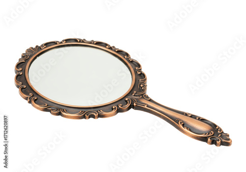 Isolated vintage handheld mirror with decorative bronze frame on seamless backdrop