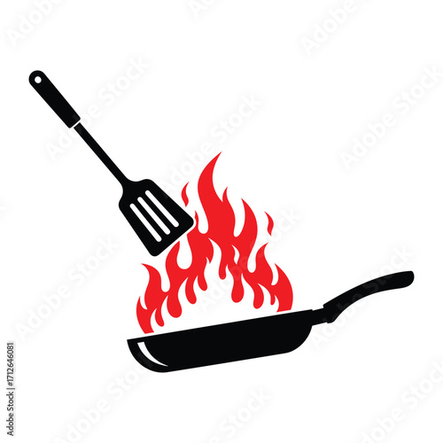 Sizzling hot food cooking on flame with spatula kitchen concept minimalist design
