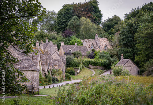 Quaint stone cottages of Bibury village in the Cotswolds, England