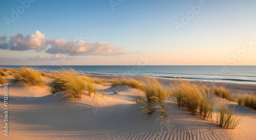 Fototapeta Naklejka Na Ścianę i Meble -  Beautiful beach sunset over the ocean with waves and clouds in the sky