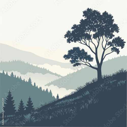 A solitary majestic tree stands silhouetted on a grassy hillside overlooking a layered landscape of misty mountains and evergreen forests under a pale sky