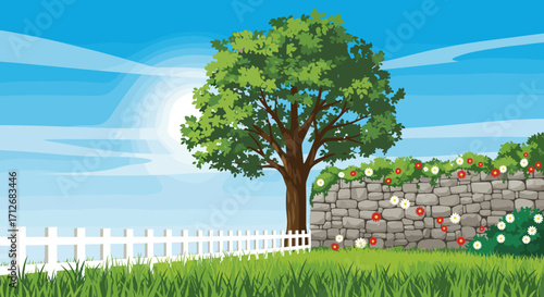 A beautiful green tree stands tall in a sunny garden with a stone wall and white fence.